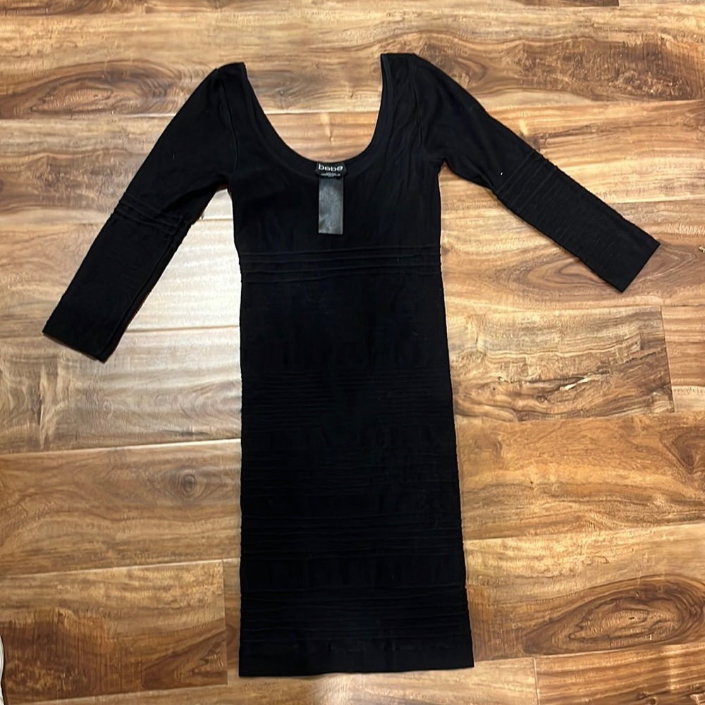 Tight black dress, three quarter sleeves